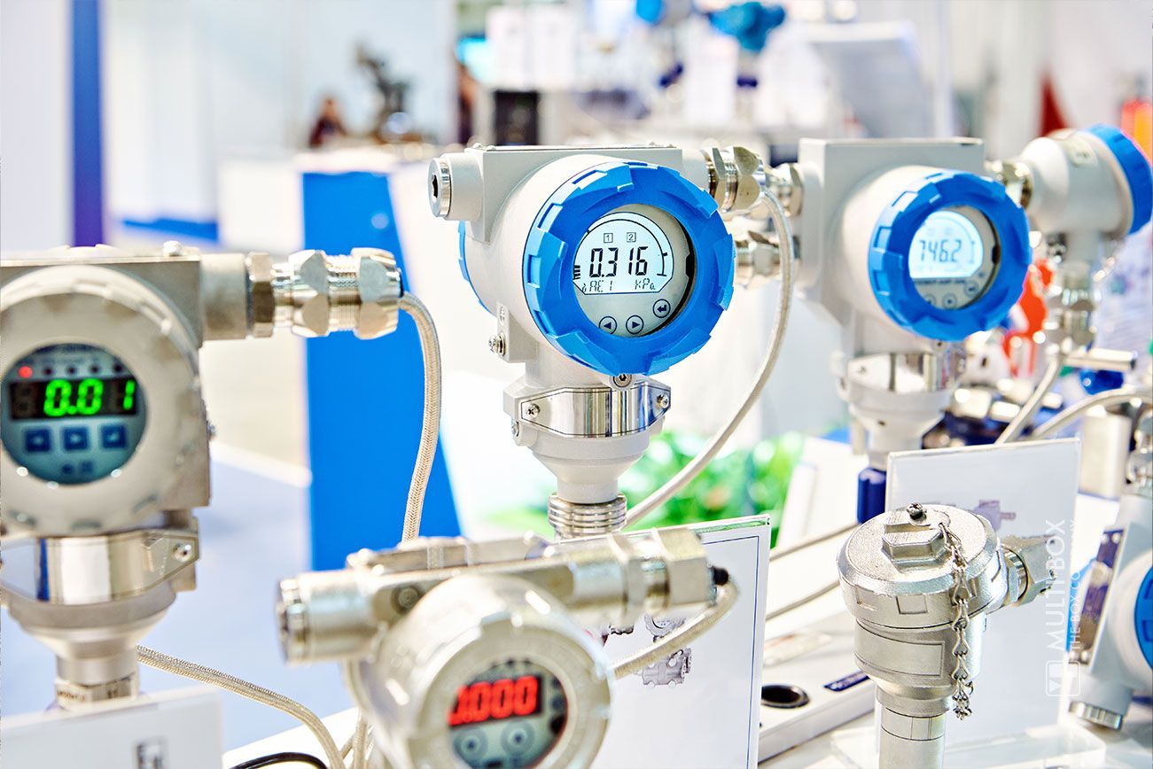 Various digital measuring devices for pressure and process monitoring displayed on a table up close.